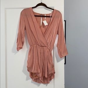 Peach colored small boutique romper